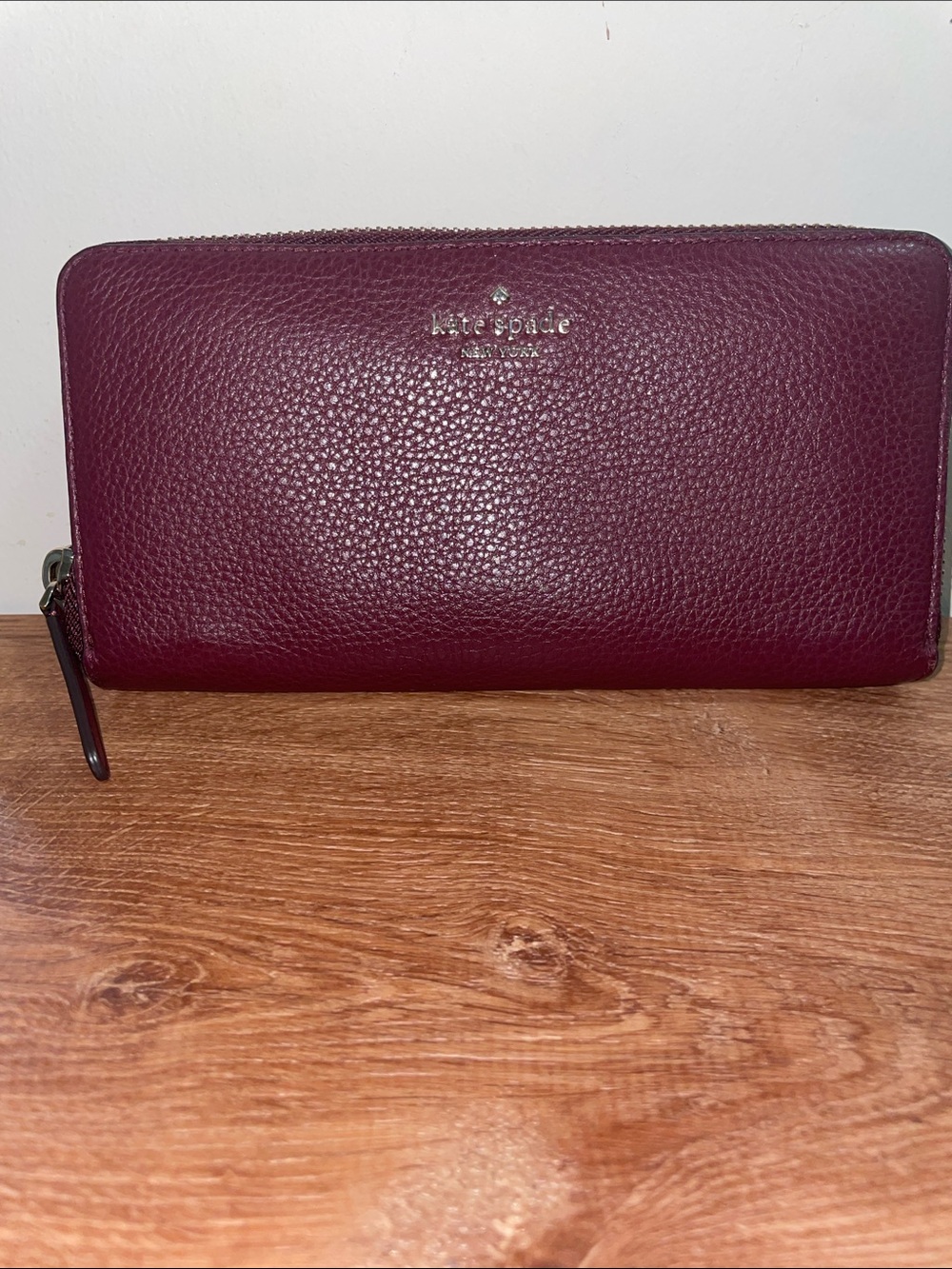 kate spade Pebbled Leather Zip Around Wallet in Burgundy